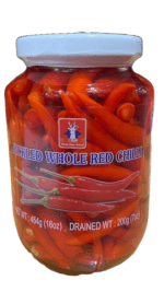 Jar of pickled whole red chilies.