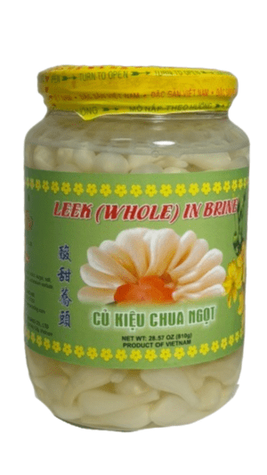 Jar of pickled whole leeks in brine.