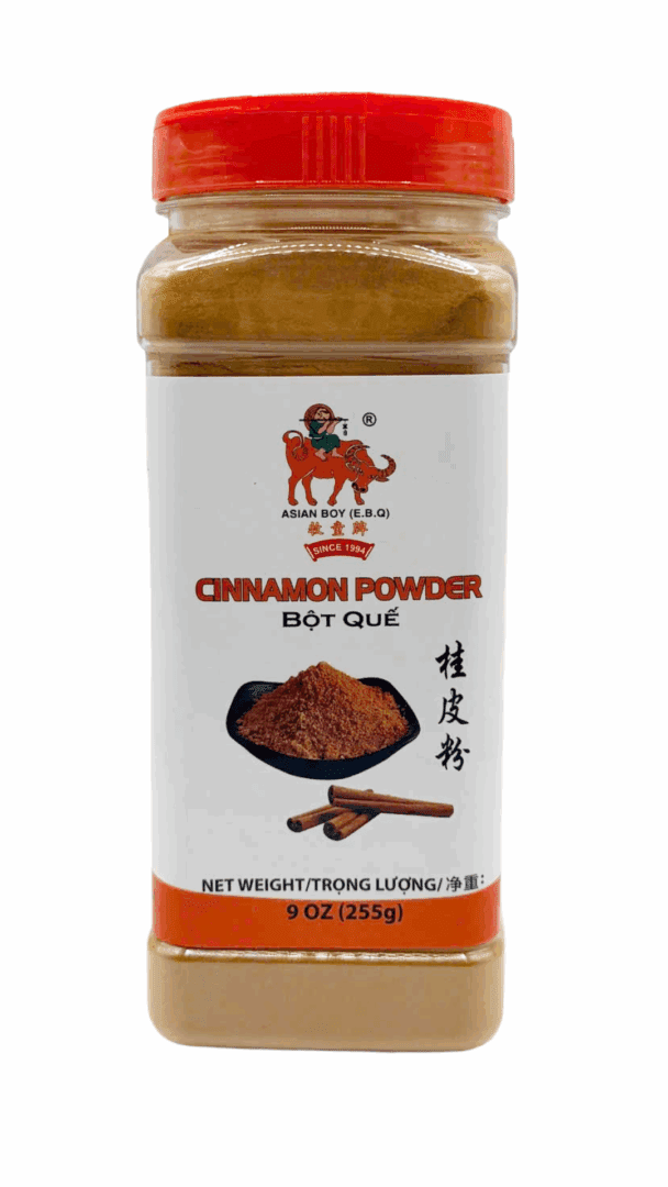 Cinnamon powder bottle with red cap.